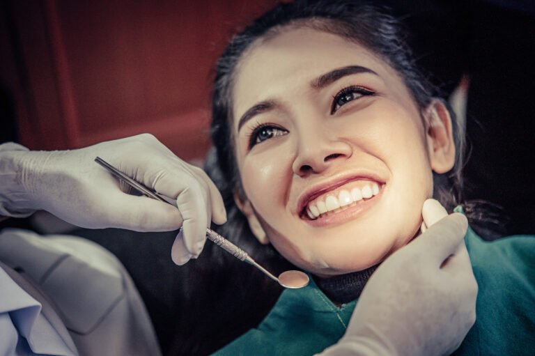 smiling-patient-dental-check-up-mirror